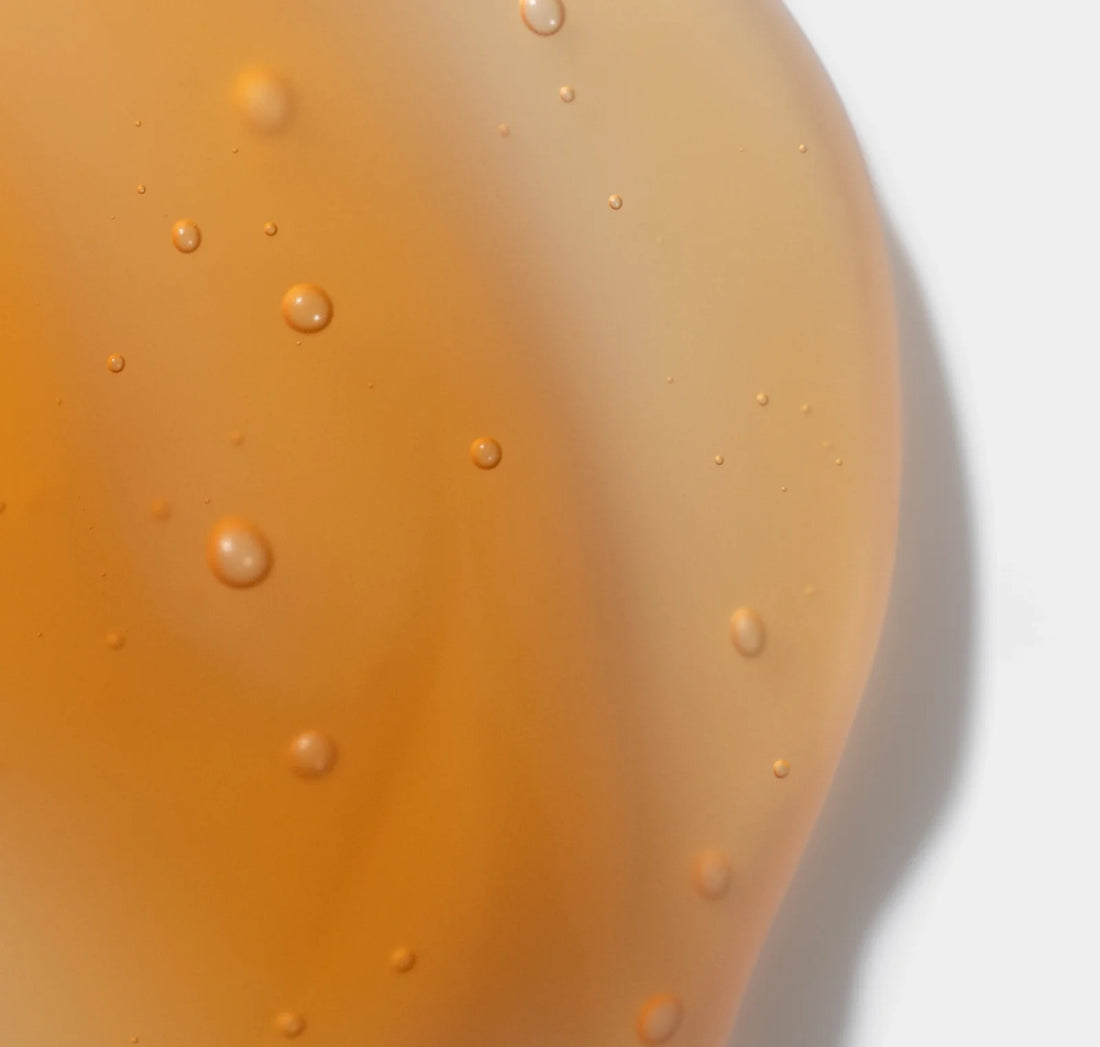 iS Clinical GeneXC Firming Eye Gel close-up of amber gel texture with tiny bubbles