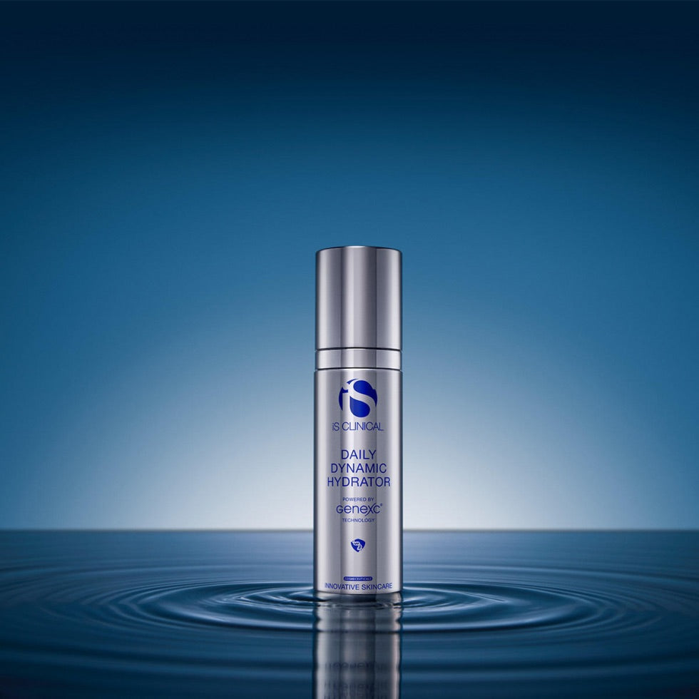 Silver pump bottle of iS Clinical Daily Dynamic Hydrator standing in water with ripple effect