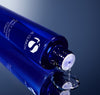 Daily Active Smoothing Toner bottle lying on its side with a drop of clear toner falling from the cap