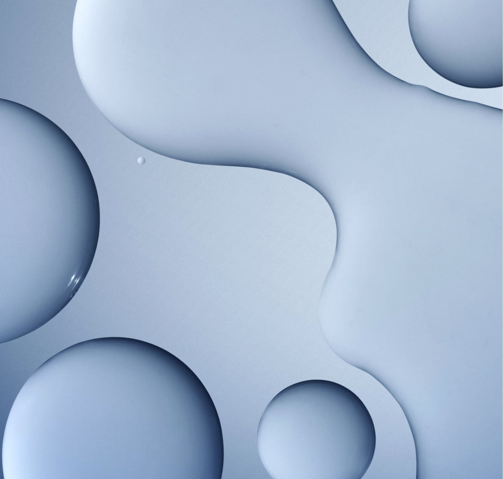 Close-up of the clear, water-light texture of Daily Active Smoothing Toner in soft blue tones