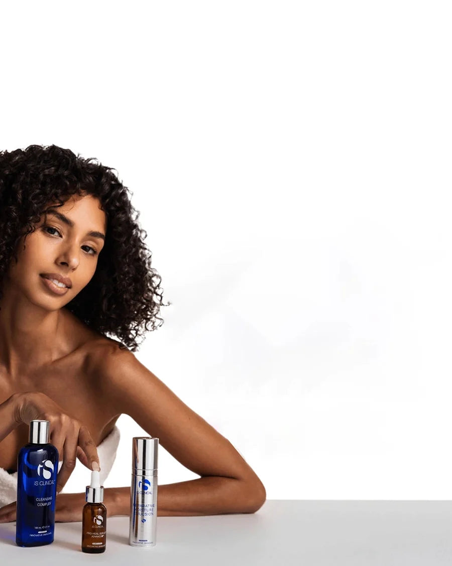 Model with iS Clinical Cleansing Complex, Pro-Heal Serum Advance+ and Reparative Moisture Emulsion