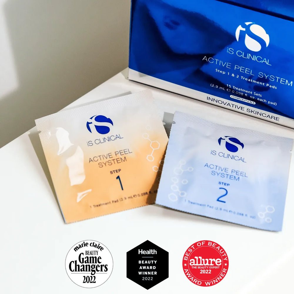 iS Clinical Active Peel System Step 1 and Step 2 treatment pads with blue packaging and award badges