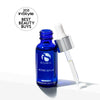 Blue glass bottle of iS Clinical Active Serum with dropper releasing clear liquid on white background
