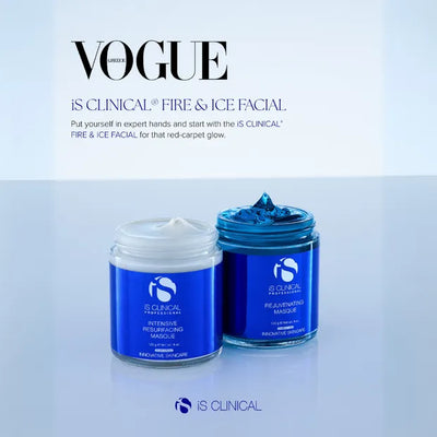 Two iS Clinical masque jars, one white Intensive Resurfacing Masque and one blue Rejuvenating Masque, on reflective surface