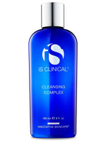 Blue bottle of iS Clinical Cleansing Complex with silver cap on white background