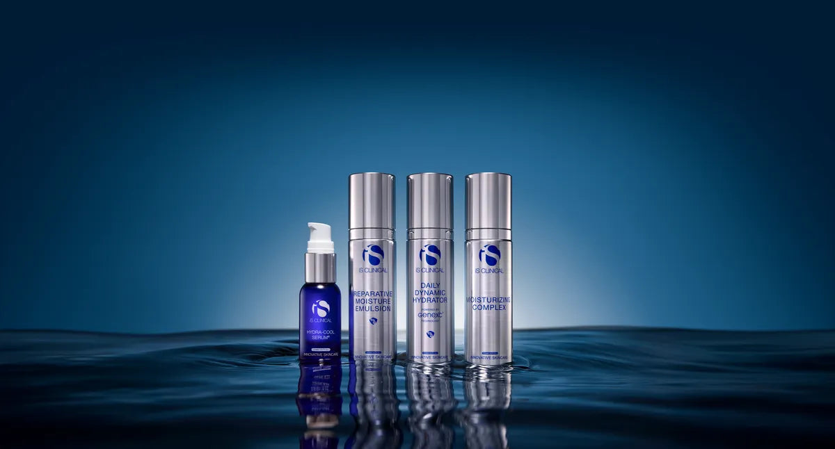 Four iS Clinical hydration products standing in water with blue gradient background