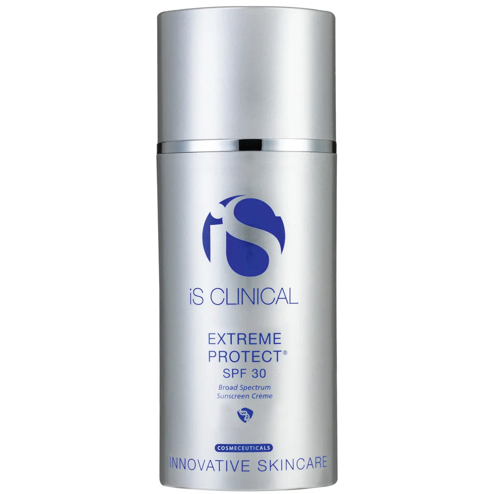 Silver pump bottle of iS Clinical Extreme Protect SPF 30 broad spectrum sunscreen crème on white background