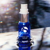 Blue glass bottle of iS Clinical Hydra-Cool Serum with white pump and silver collar on reflective surface