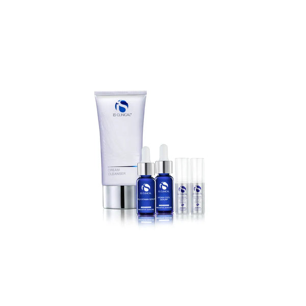 iS Clinical Cancer Care Pure Wellness Collection with cream cleanser tube, two blue serum bottles with droppers, and two small clear pump bottles