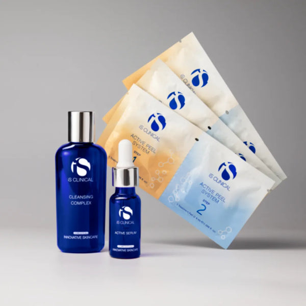 iS Clinical Limited-Edition Active Collection with blue Cleansing Complex bottle, Active Serum dropper bottle, and four Active Peel System sachets