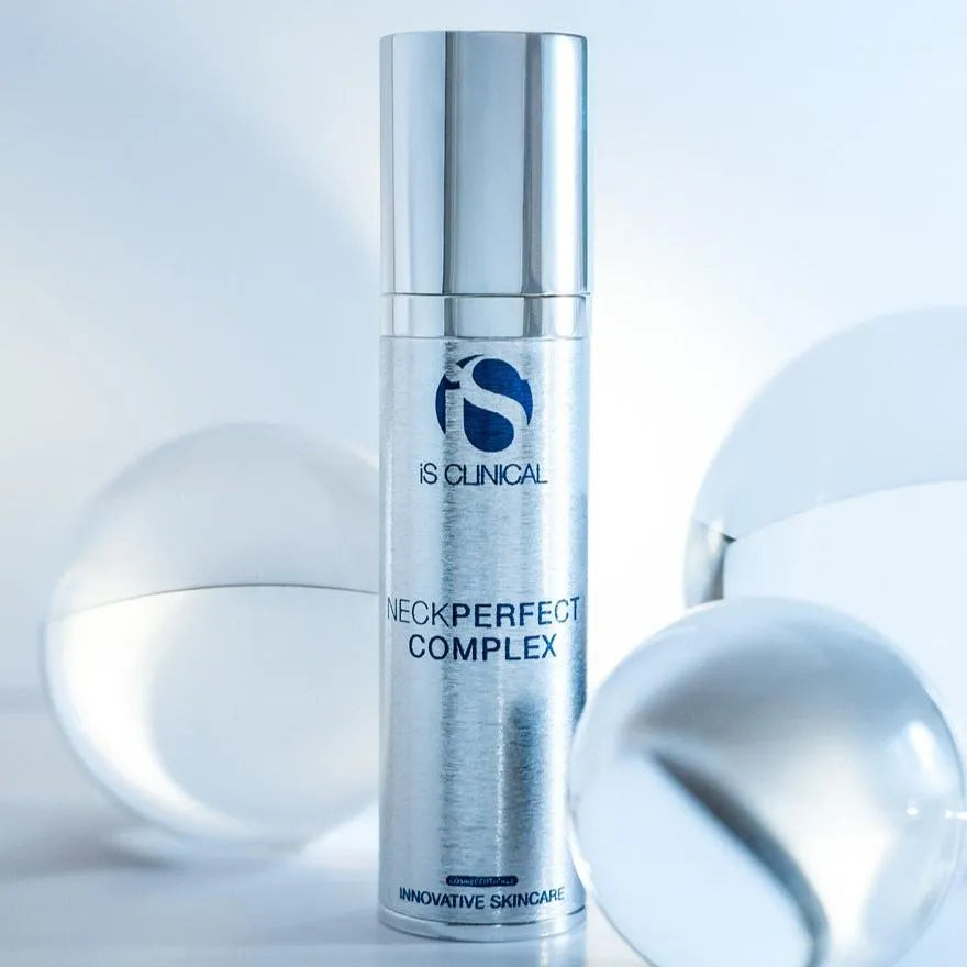 Silver cylindrical bottle of iS Clinical NeckPerfect Complex with reflective spheres on a white background