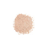 Loose beige powder of iS Clinical PerfecTint Powder SPF 40 on a white background