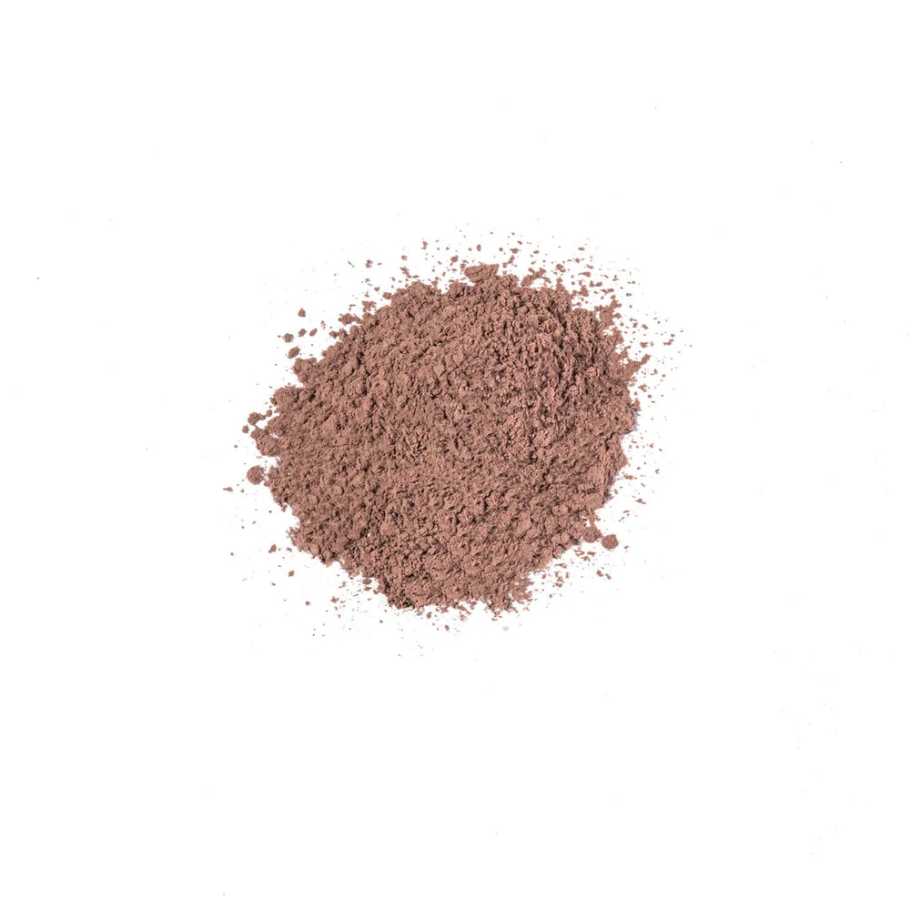 Loose brown powder of iS Clinical PerfecTint Powder SPF 40 on white background