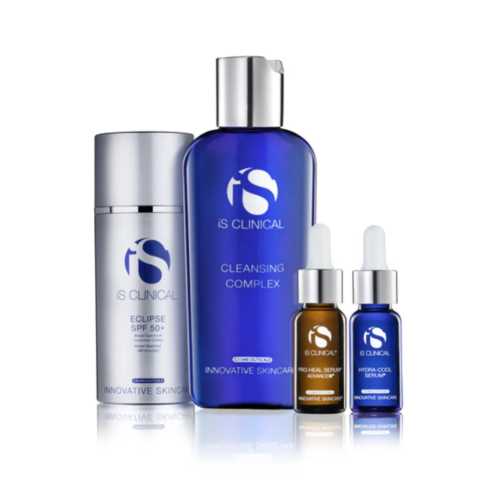 iS Clinical Pure Calm Collection with silver Eclipse SPF 50+ bottle, blue Cleansing Complex bottle, and two small dropper bottles of Pro-Heal Serum Advance+ and Hydra-Cool Serum