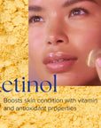 Close-up of woman applying creamy beige Retinol+ Emulsion 0.3 to cheek, yellow powder background