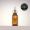 Amber glass dropper bottle of iS Clinical Super Serum Advance+ with silver cap on white background