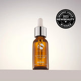 Amber glass dropper bottle of iS Clinical Super Serum Advance+ with silver cap on white background