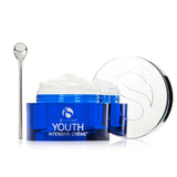 Open blue jar of iS Clinical Youth Intensive Crème with white cream and silver applicator spoon