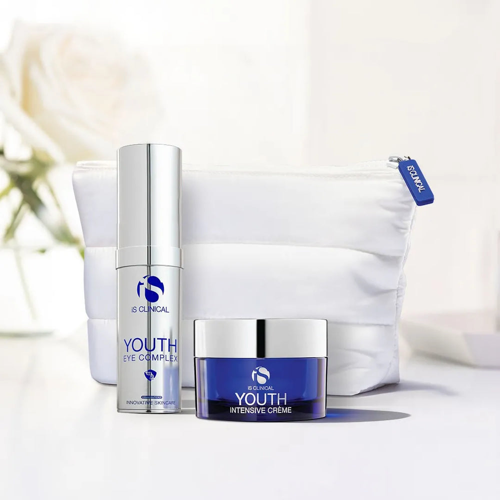 iS Clinical Youth Eye Complex pump bottle and Youth Intensive Crème jar with white cosmetic bag